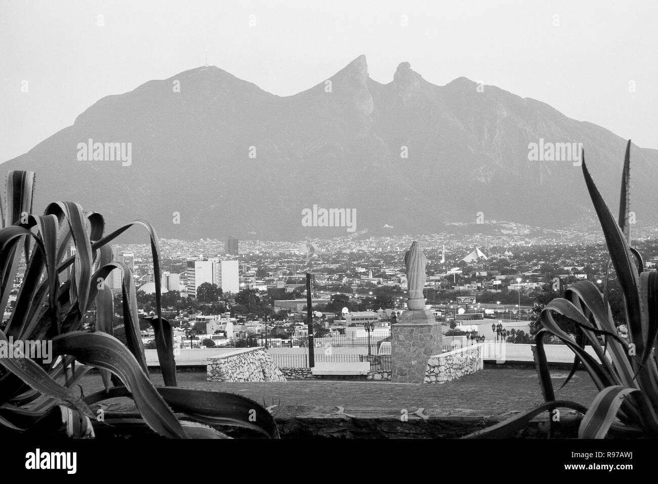 MONTERREY, NL/MEXICO - NOV 20, 2002: View from the Bishop's museum, Virgin of the Immaculate Conception sculpture and La Silla hill Stock Photo