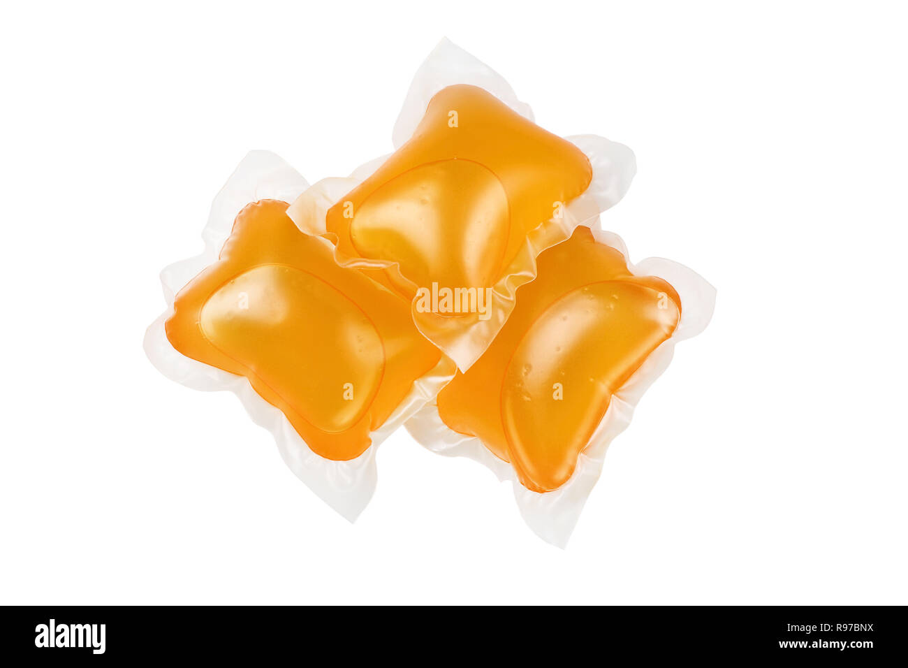 Three pods of washing detergent isolated on a white background with clipping path included. Stock Photo