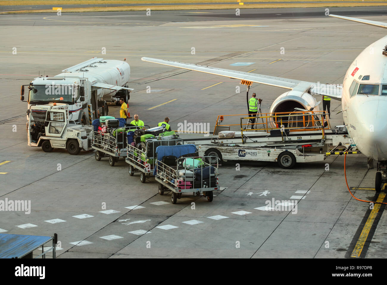 Prague, Czech Republic - July 28th, 2018: Ground staff loading luggage into Tailwind Boeing 737-400 at Ruzyne, Vaclav Havel Airport. Stock Photo