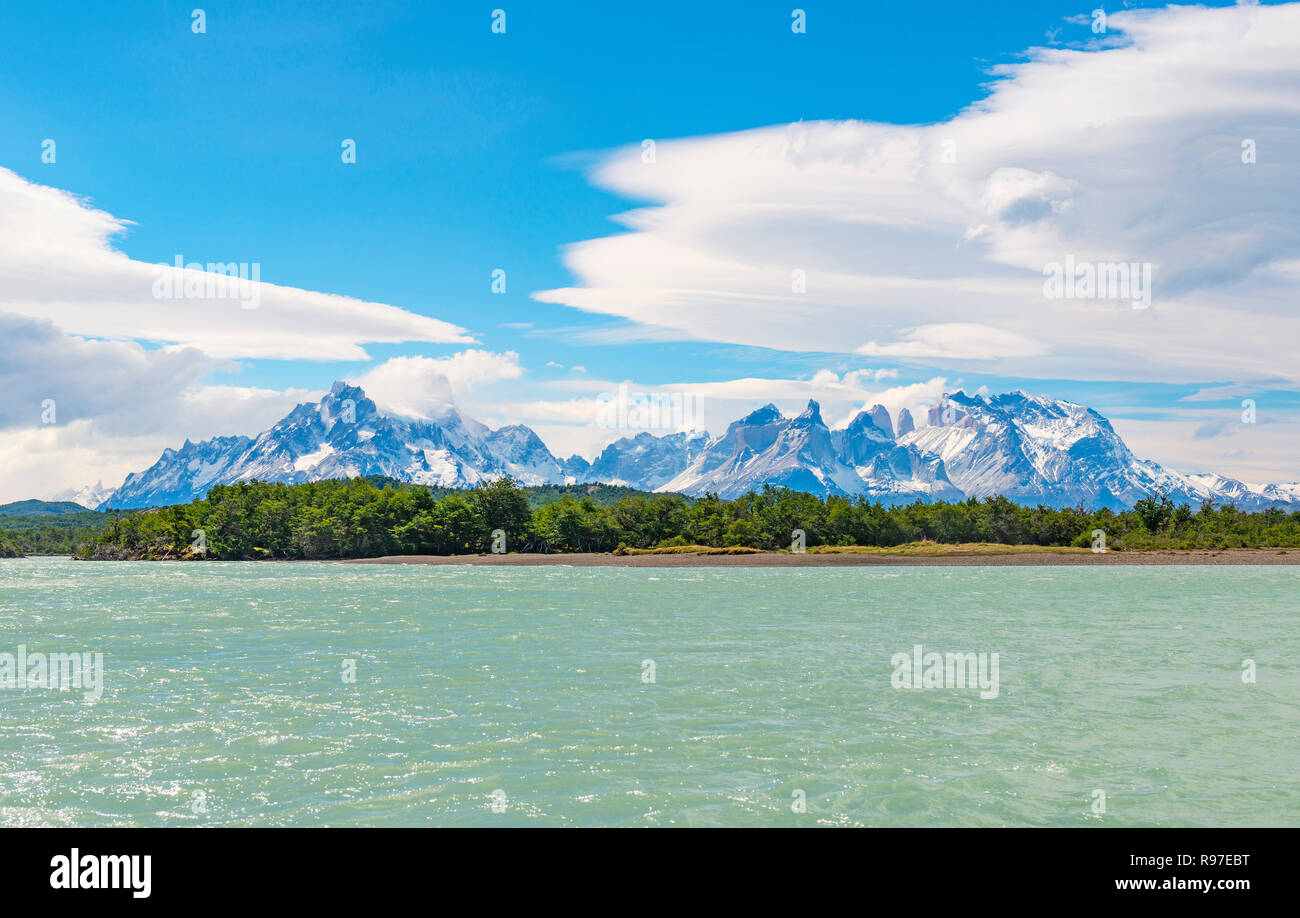 Panorama of the Cuernos and Torres del Paine peaks with the Serrano river in the foreground, Patagonia, Chile. Stock Photo