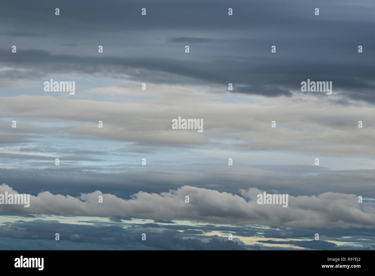 Background with grey and white clouds in the sky Stock Photo