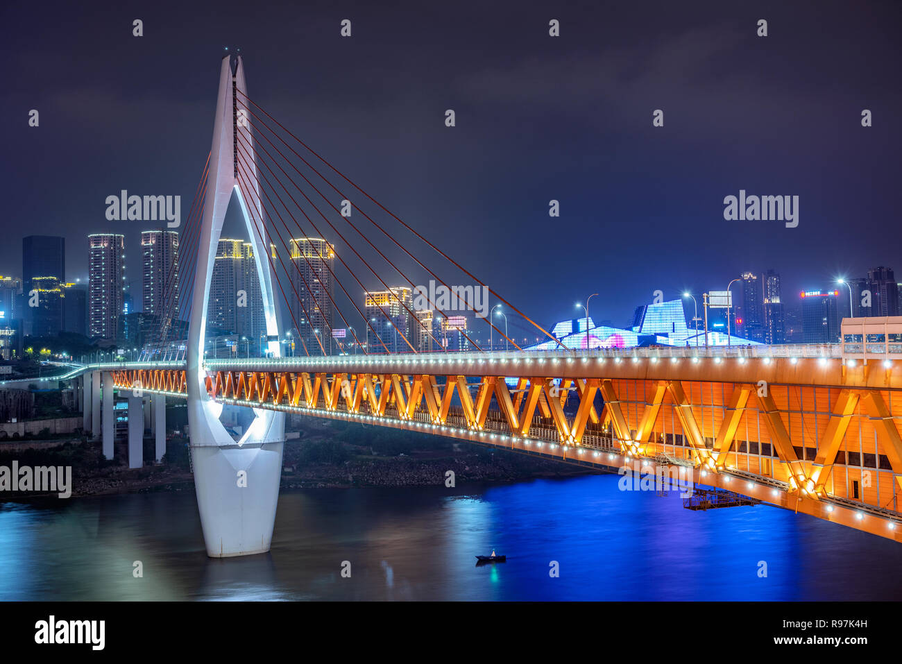 This is a night view of the famous Qiansimen bridge, a popular travel destination along the Jialing river Stock Photo