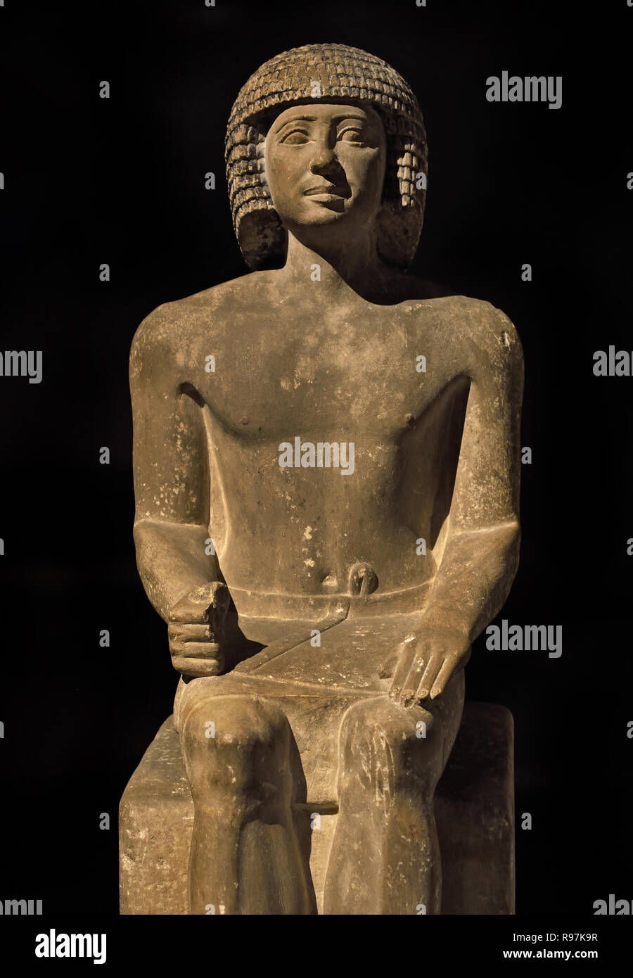 Sitting of a man (anonymous) 76 x 27 x 35 cm, 150 kg limestone, Period: Old Empire; 5th Dynasty 2465-2323 BC Egypt, Egyptian. Stock Photo