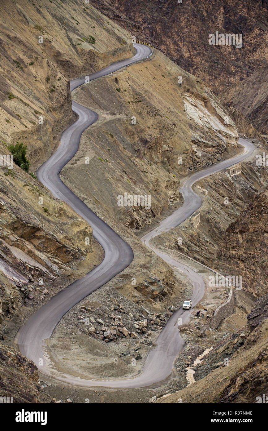 Sharp curve on mountain road in Himalaya mountains, Ladakh region, India Stock Photo