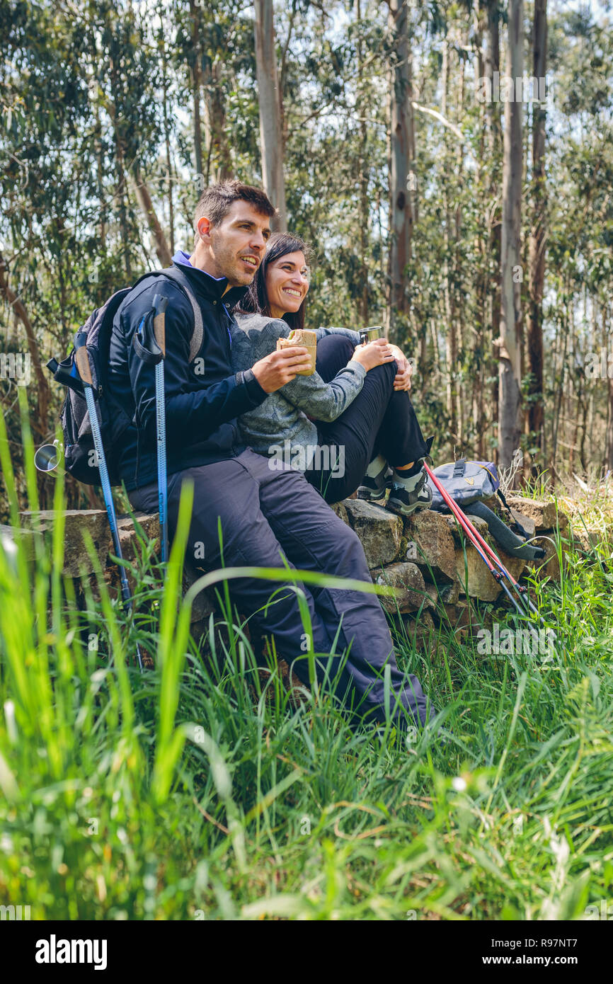 Couple pausing while doing trekking Stock Photo Alamy