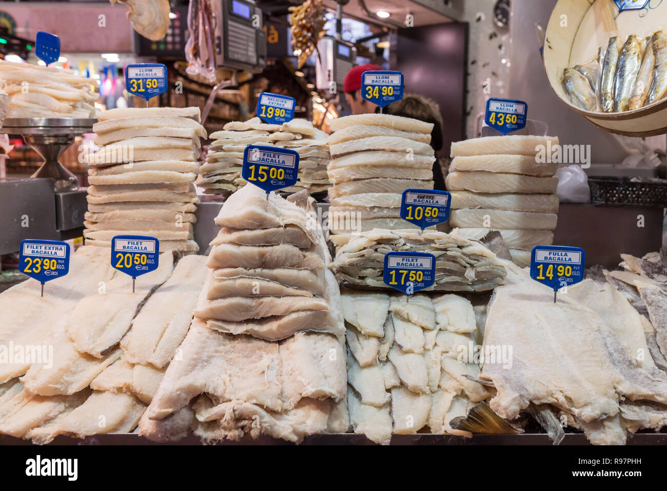 Salted cod fish Bacalao La Boqueria market. La Boqueria market - is a large public market and popular tourist landmark in Barcelona Stock Photo