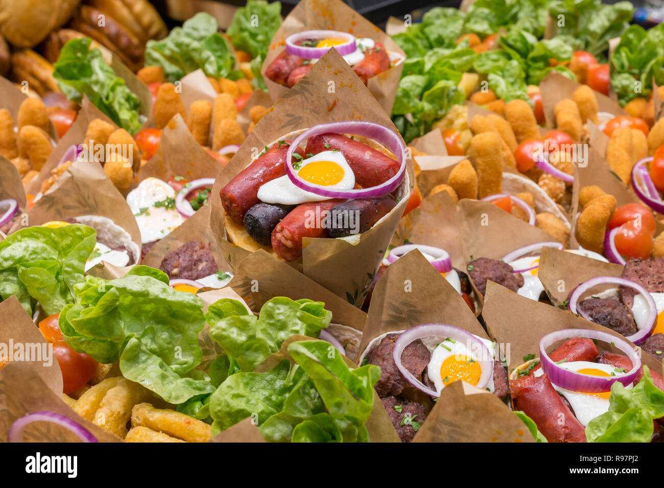 Meat snacks for sale at  Mercat de Sant Josep de la Boqueria, a large public market in Barcelona, Spain. Stock Photo