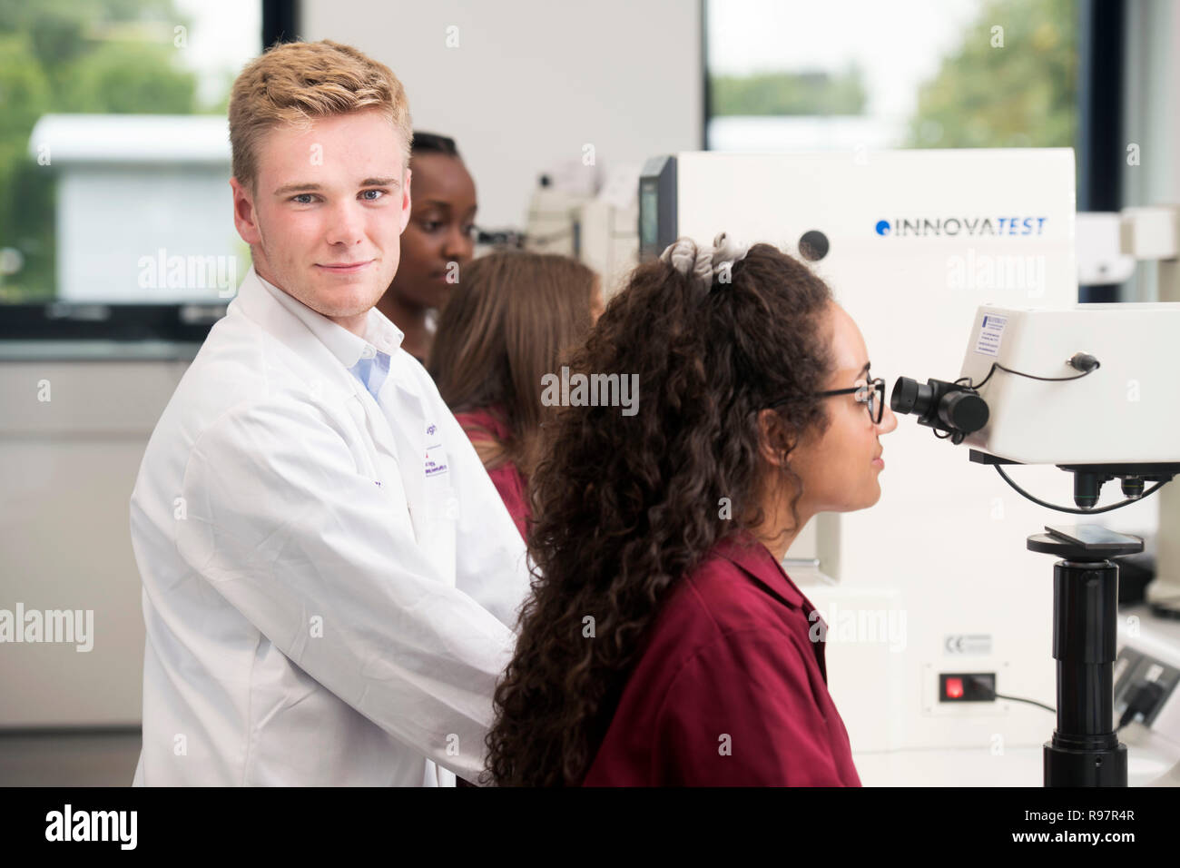 Students in the Loughborough University STEMLAB building  operating hardness testing equipment UK Stock Photo