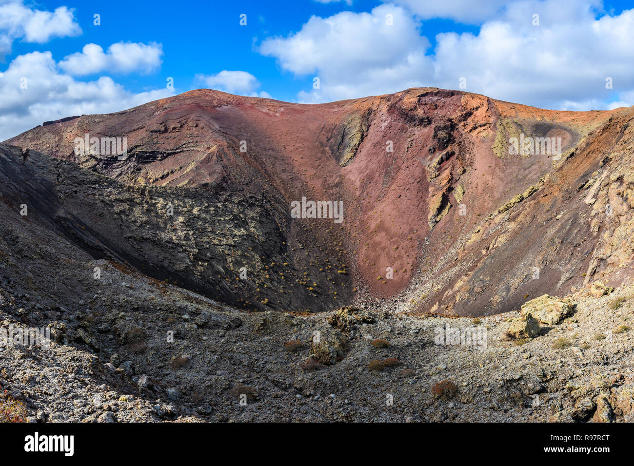 Red crater in the volcanic Timanfaya National Park, Lanzarote, Spain Stock Photo