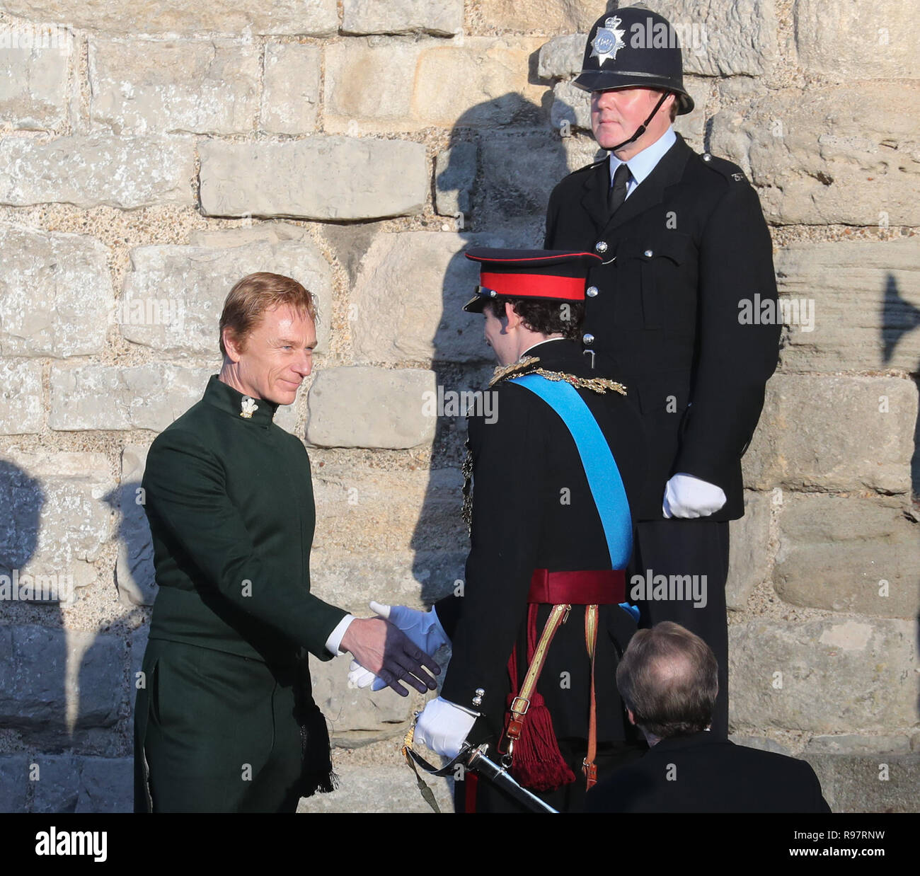 Josh O'Connor and Ben Daniels film a scene for the Netflix drama at Caernarfon Castle. Prince Charles is welcomed to Caernarfon Castle by Anthony Armstong-Jones, Lord Snowdon the Constable of Caernarfon Castle, ahead of his investiture. Featuring: Ben Daniels, Josh O'Connor Where: Caernafon, Gwynedd, United Kingdom When: 18 Nov 2018 Credit: WENN.com Stock Photo