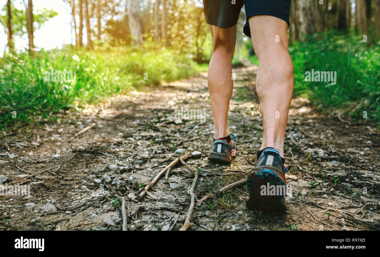 Feet of man participating in trail race Stock Photo
