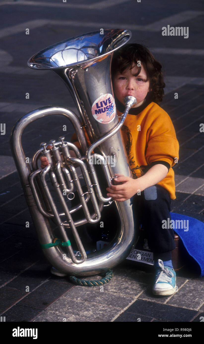 YOUNG BUSKER PLAYING  THE TROMBONE, SYDNEY, NEW SOUTH WALES, AUSTRALIA Stock Photo