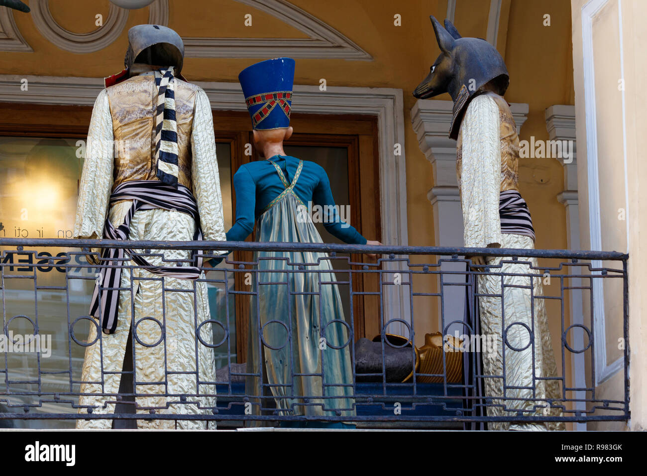 Movie mannequin characters and costumes on display along a department