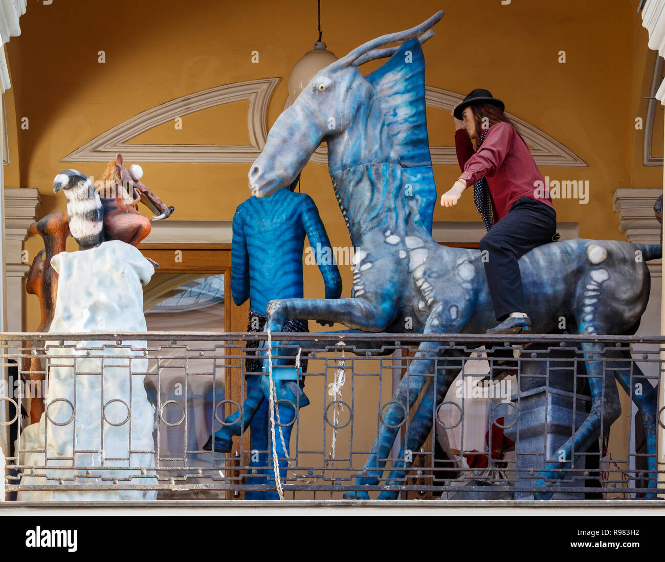 Movie mannequin characters and costumes on display along a department