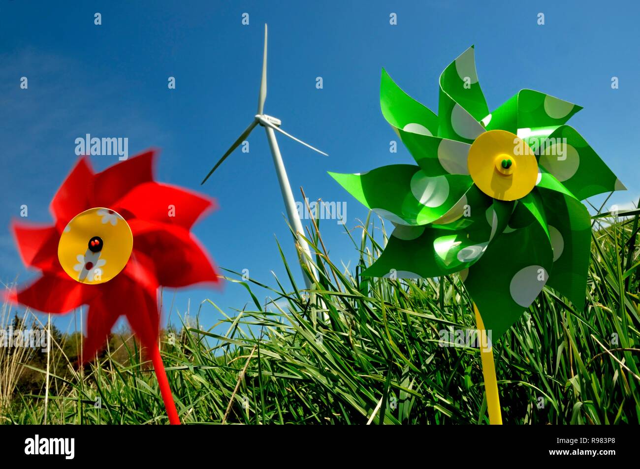 Pinwheels in front of wind turbines, symbolic image wind energy Stock Photo