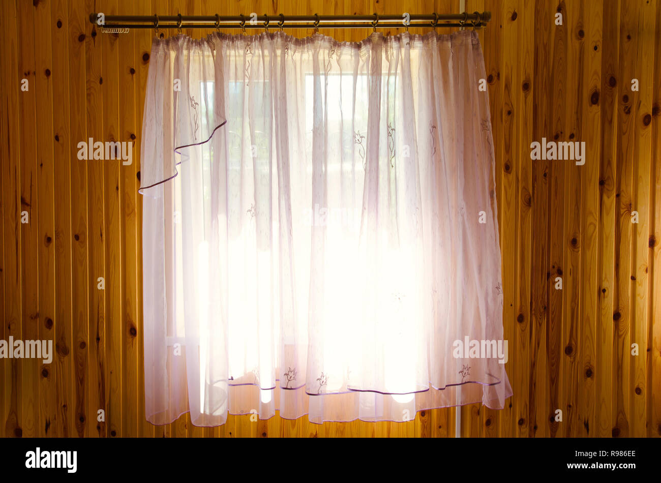 window curtain in a wooden wall Stock Photo