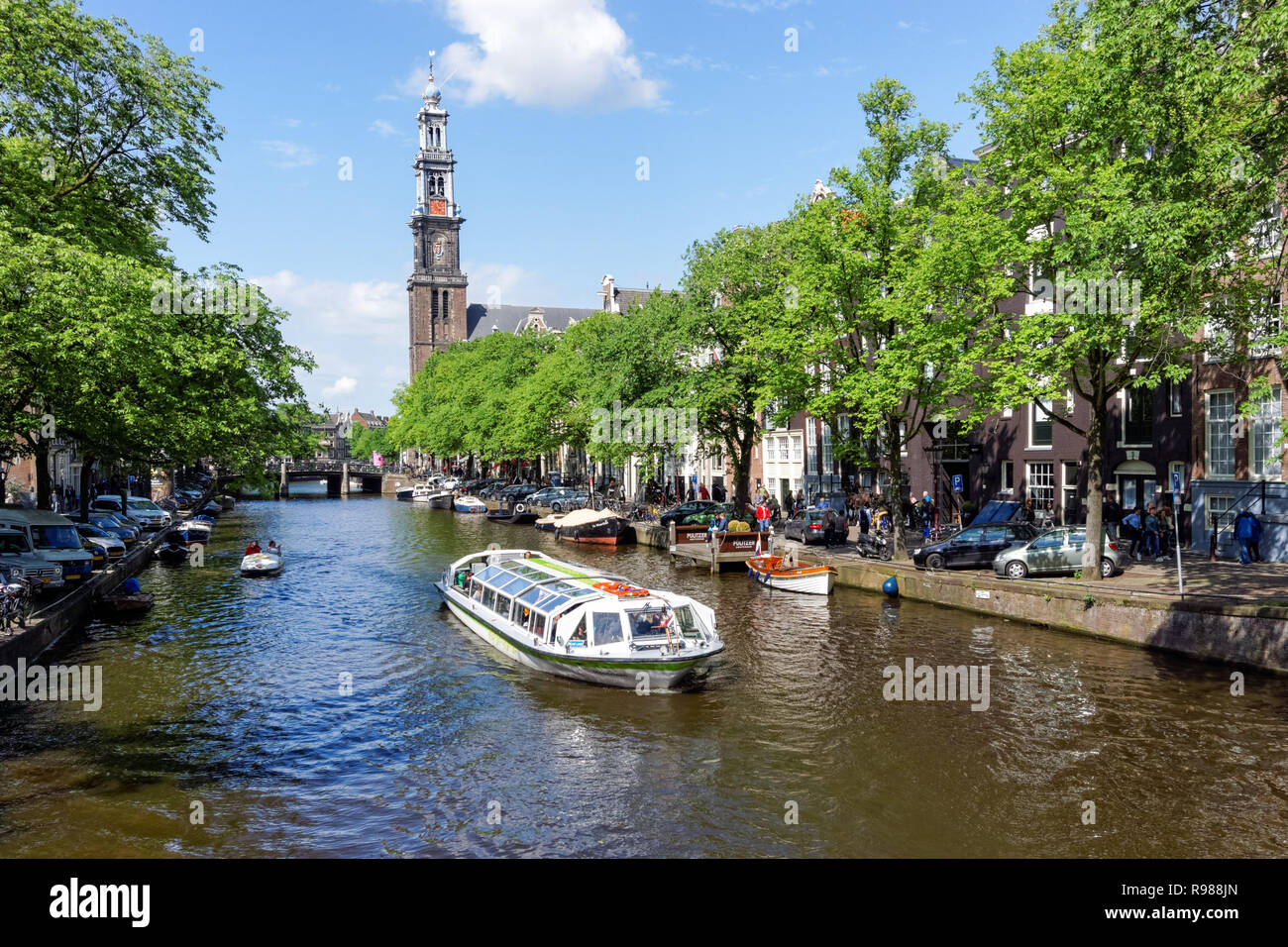 Tourist cruise boat on Prinsengracht canal in Amsterdam, Netherlands Stock Photo
