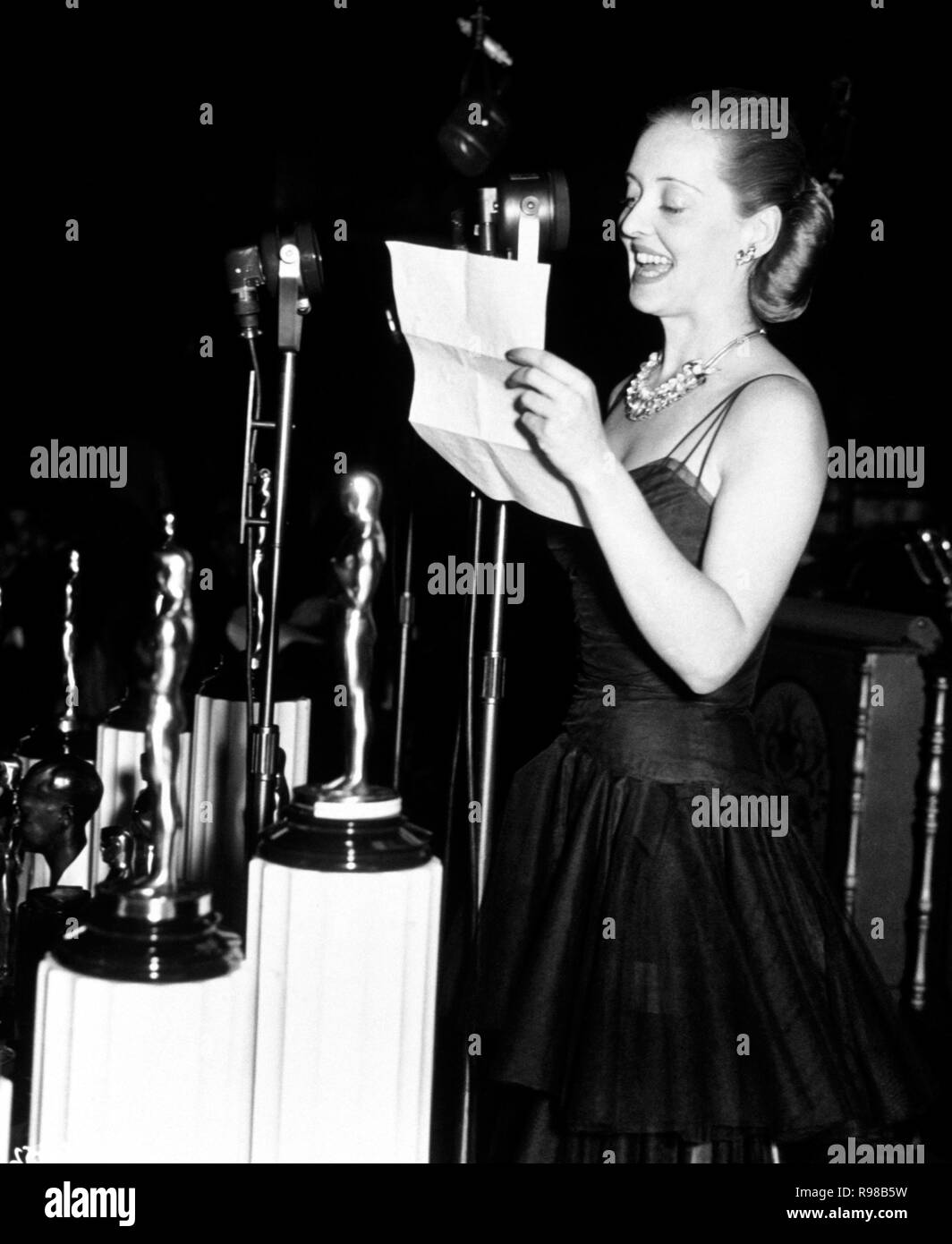 The 28th Academy Awards / 1956.   Bette Davis presents the best actor award. Stock Photo