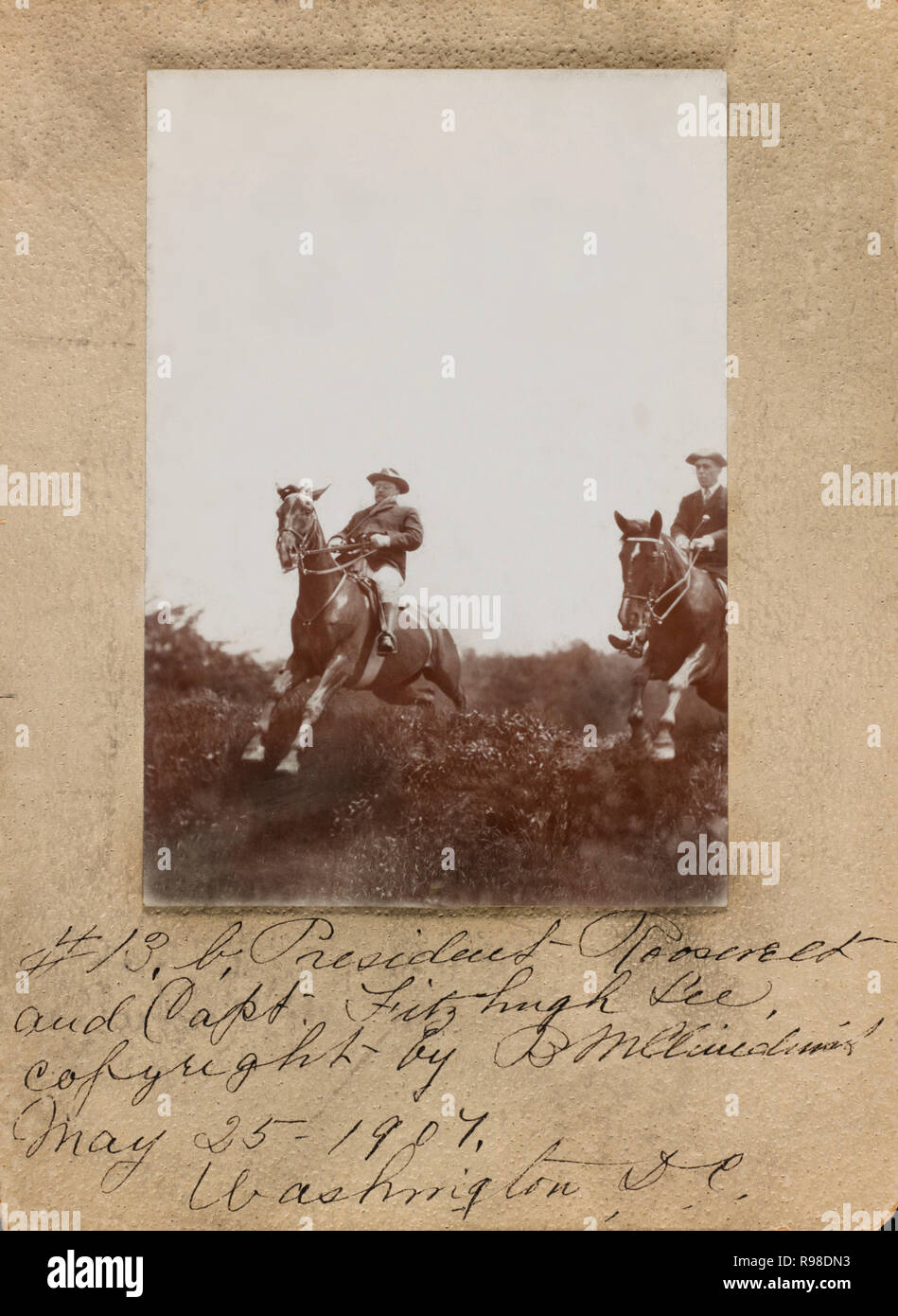 U.S. President Theodore Roosevelt and Captain Fitzhugh Lee Horseback Riding, Jumping over Hedge, Washington DC, USA, by Barnett McFee Clinedinst, May 25, 1907 Stock Photo