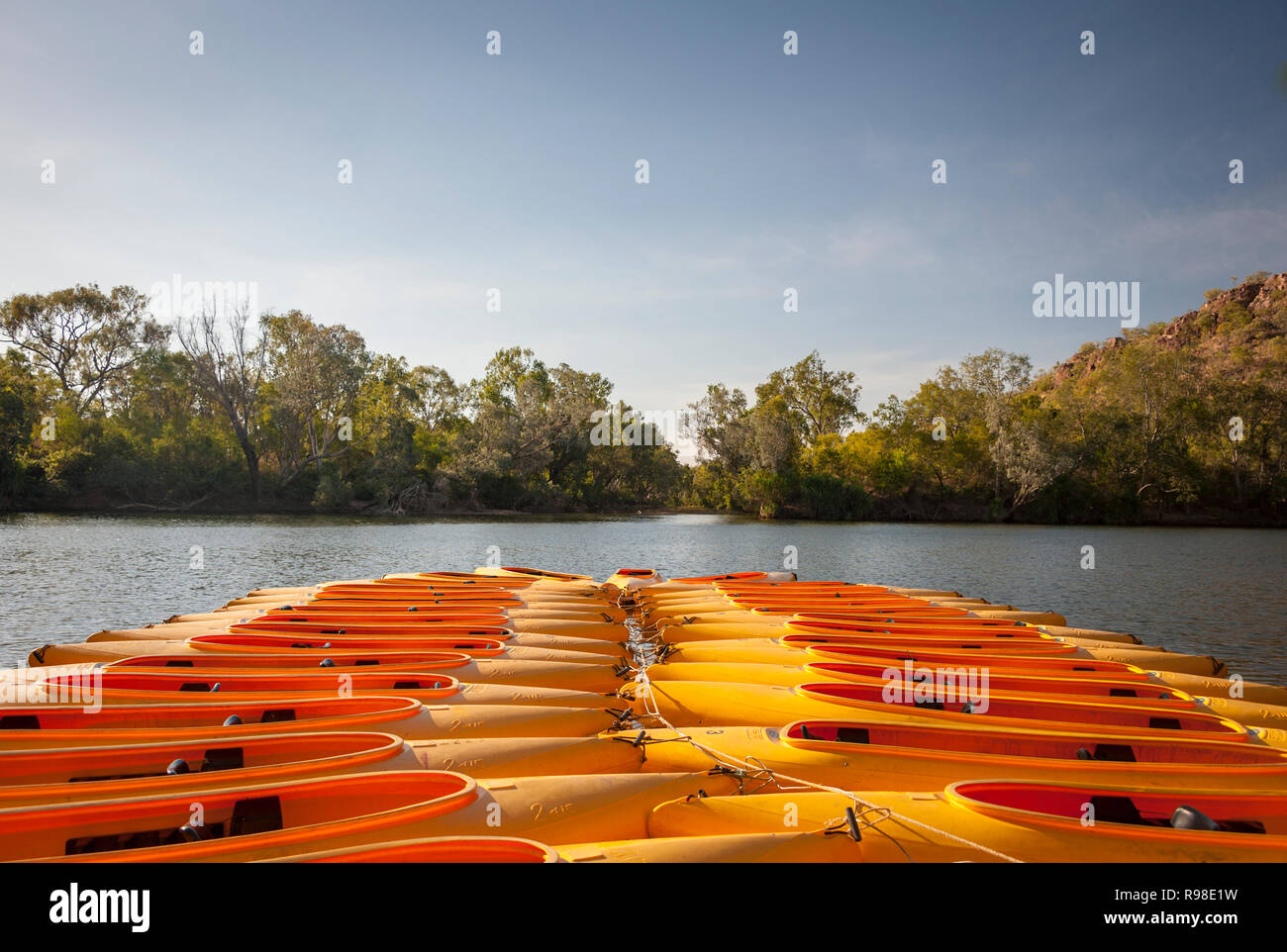 Canoes for hire creating a colorful pattern against the river, Katherine Gorge, Northern Territory Australia Stock Photo