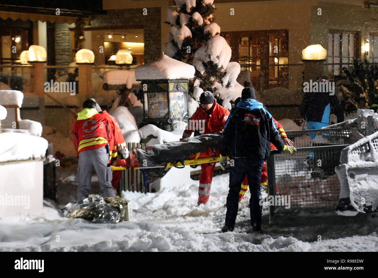 16 January 2016 - Hinterglemm, Austria: Rescue paramedic team moves injured after accident skier from ratrack machine into ambulance. Ski resort emerg Stock Photo