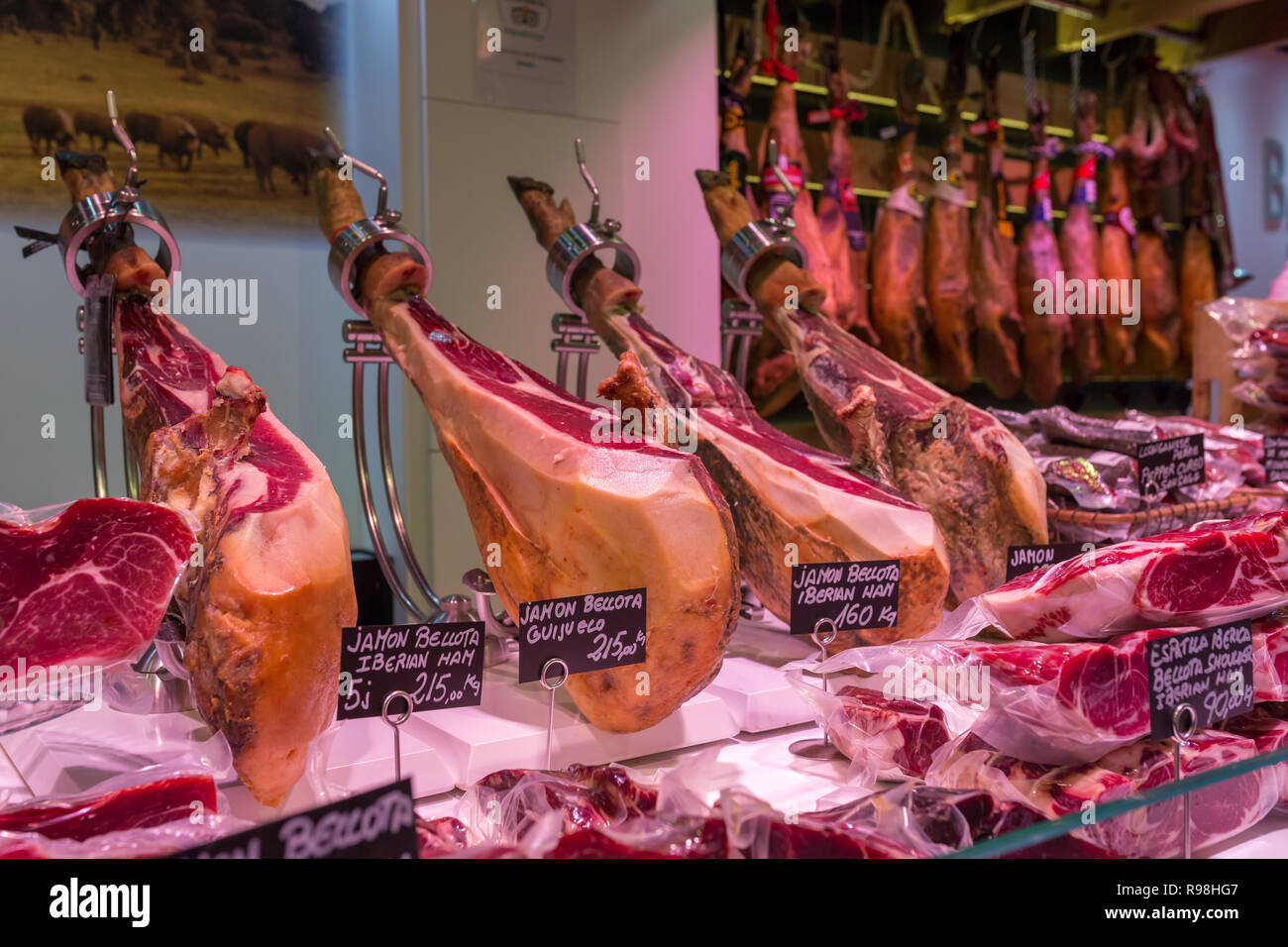 Boqueria market, jamon and sausages on the counter of the Spanish market Stock Photo