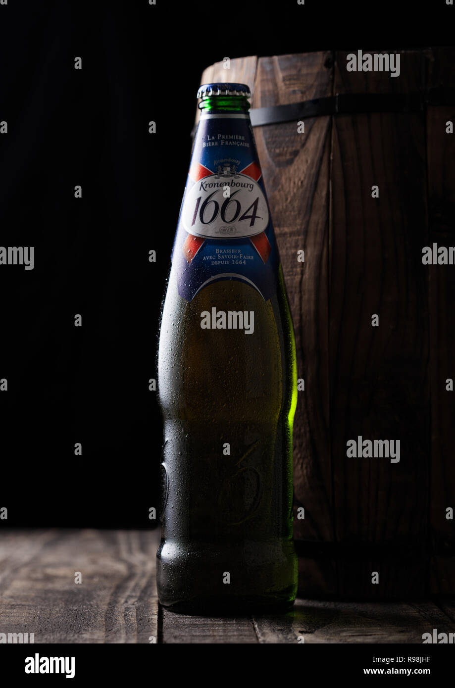 LONDON, UK - AUGUST 10, 2018: Cold bottle of Kronenbourg 1661 beer next ...