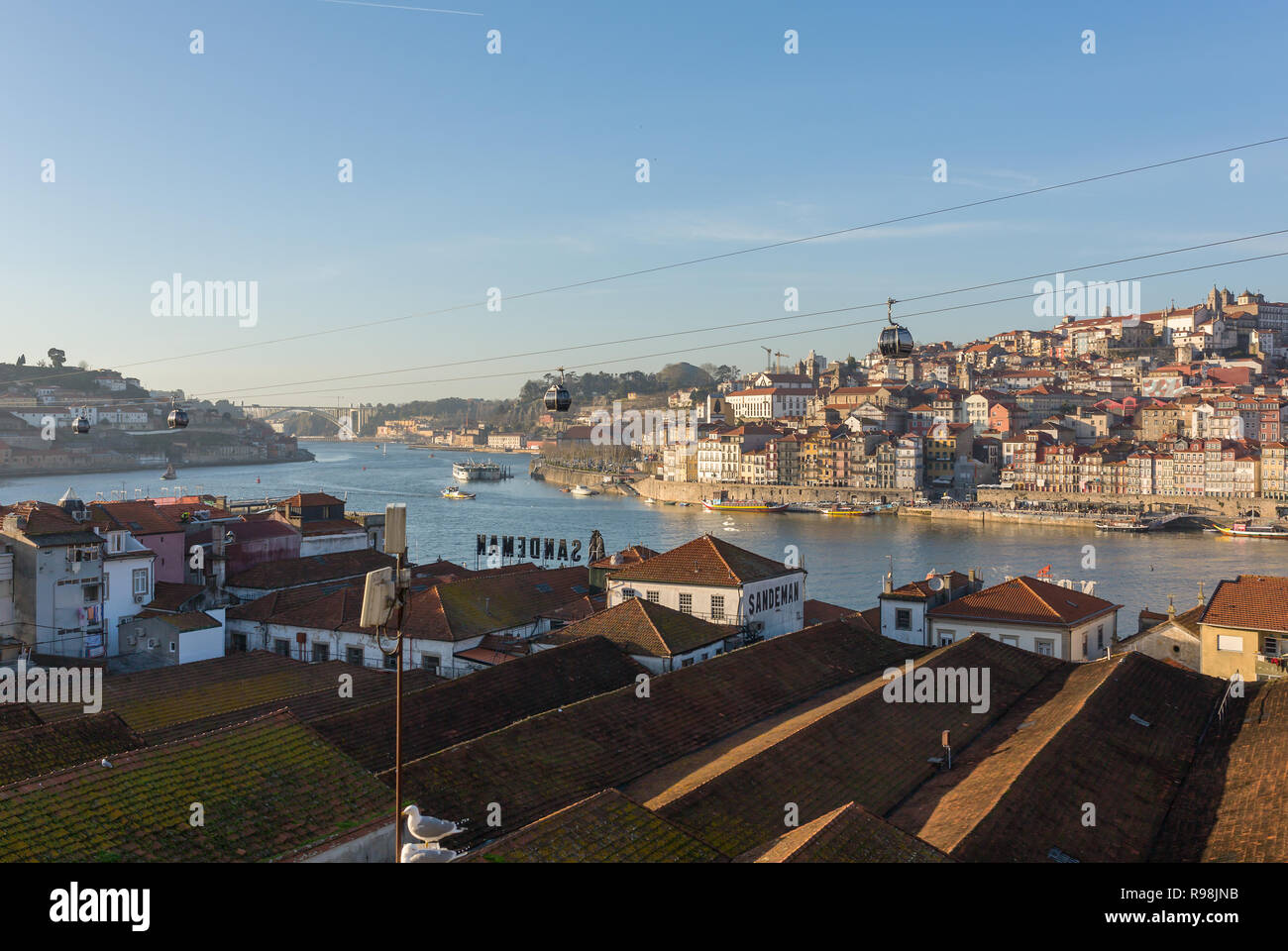 Porto, Portugal - Januaryt 19, 2018: View of the historic city of Porto with cable cars and boats on Douro river, Portugal Stock Photo