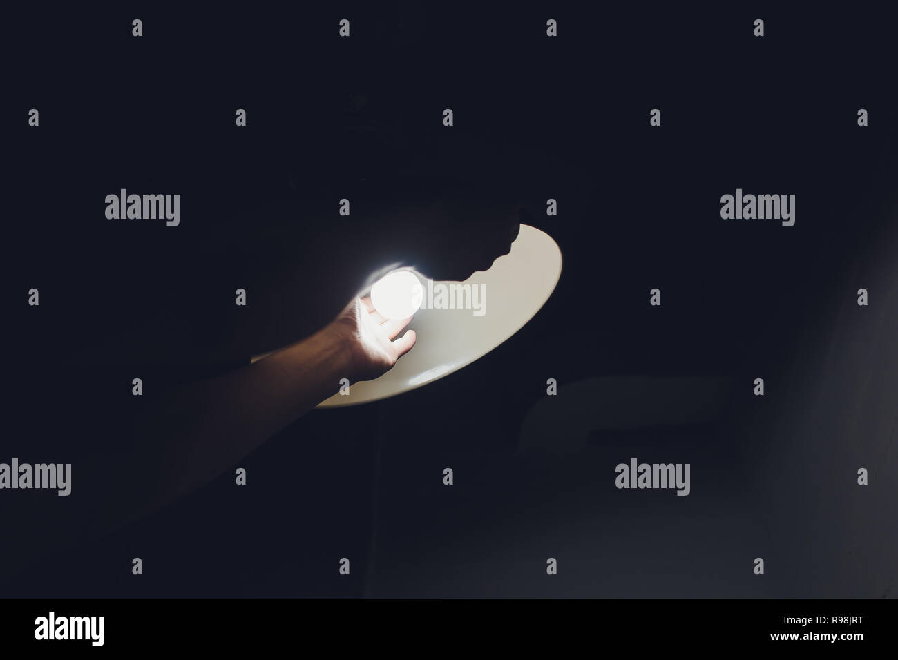 Hands changing with new LED lamp light bulb,Power saving concept. Stock Photo
