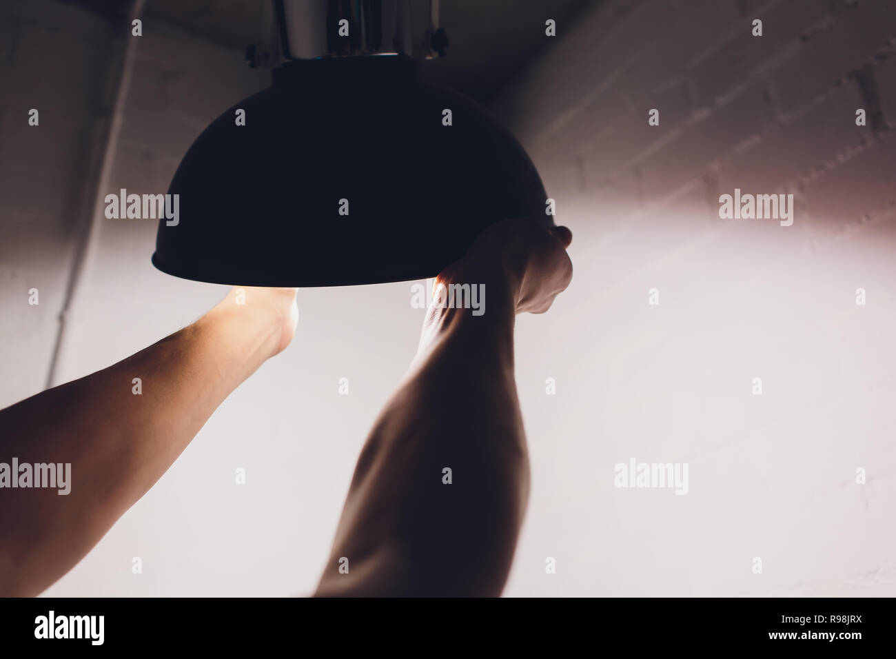 Hands changing with new LED lamp light bulb,Power saving concept. Stock Photo