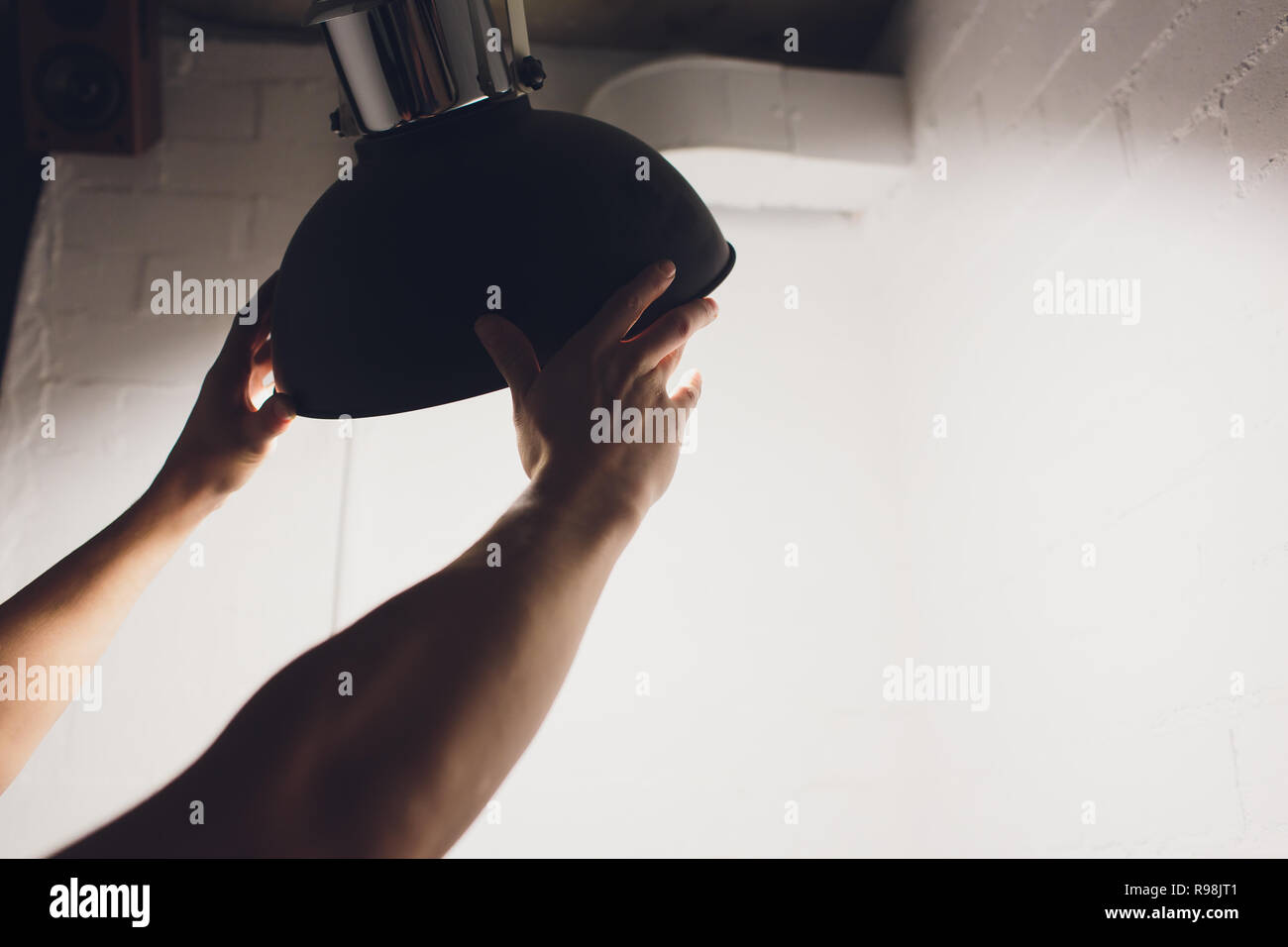 Hands changing with new LED lamp light bulb,Power saving concept. Stock Photo