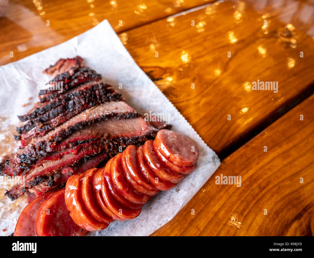 Close Up view of Pork Sausage and Brisket On Wood Table Stock Photo Alamy