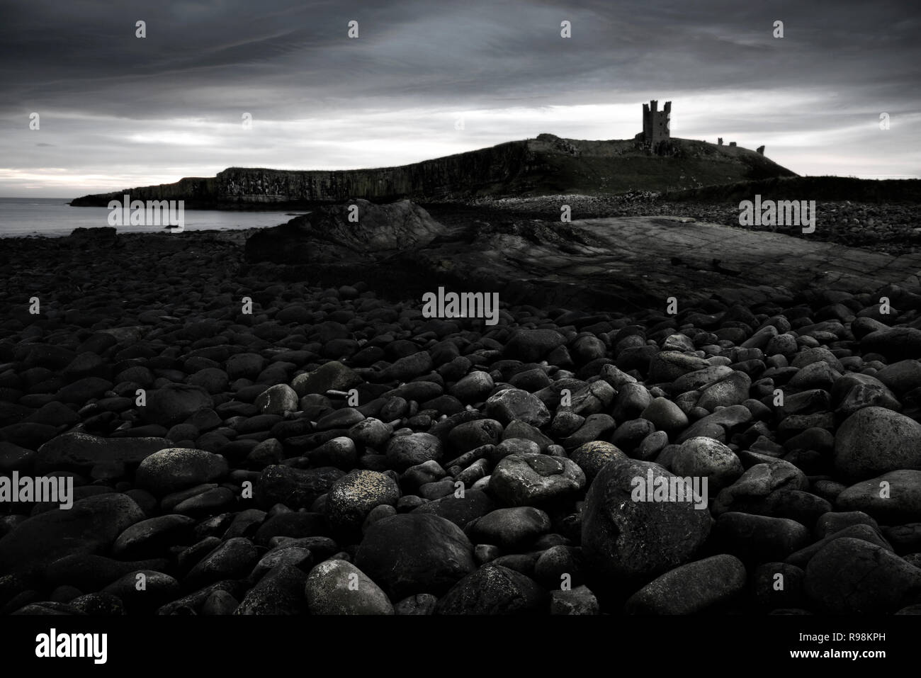 Dunstanburgh Castle (in mono), Northumberland, England (1) Stock Photo