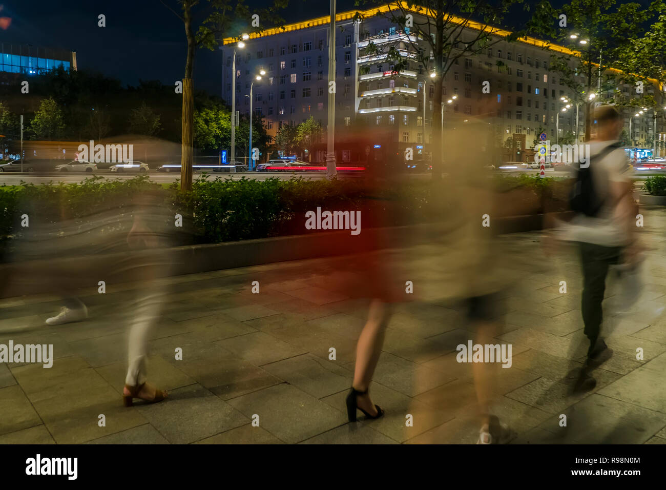 the flow of pedestrians and cars following the city street Stock Photo ...