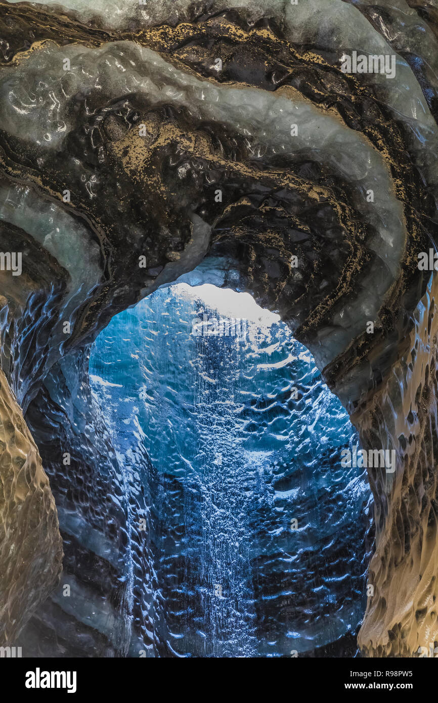 The melted vertical shaft of a moulin, aka glacier mill, the dramatic