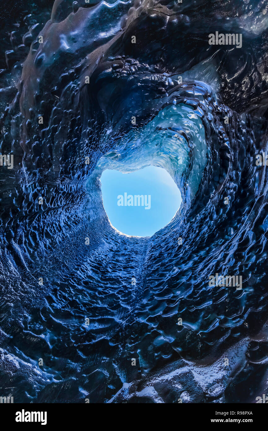 The melted vertical shaft of a moulin, aka glacier mill, the dramatic