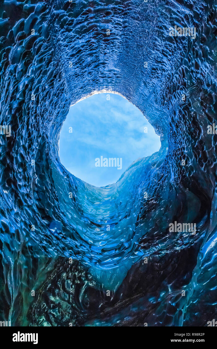 The melted vertical shaft of a moulin, aka glacier mill, the dramatic