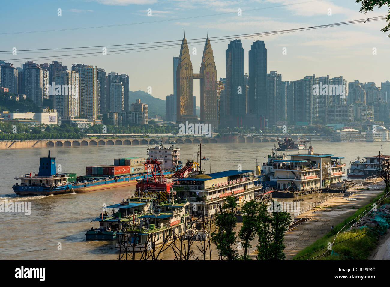 CHONGQING, CHINA - SEPTEMBER 19: Yangtze River view of city buildings and boats near the Chaotianmen docks on September 19, 2018 in Chongqing Stock Photo