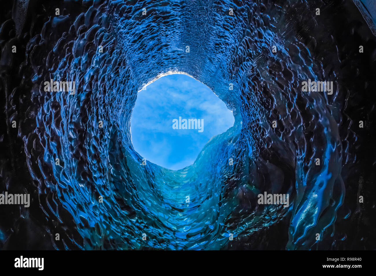 The melted vertical shaft of a moulin, aka glacier mill, the dramatic