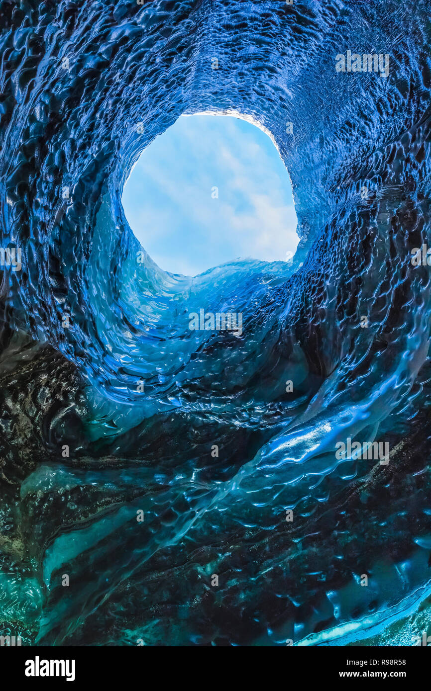 The melted vertical shaft of a moulin, aka glacier mill, the dramatic