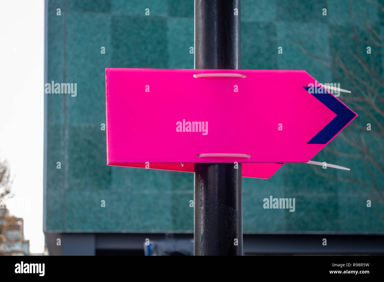 Plastic Purple directional arrow sign fastened to a lamp post with plastic cable  ties in London W1, England Stock Photo - Alamy
