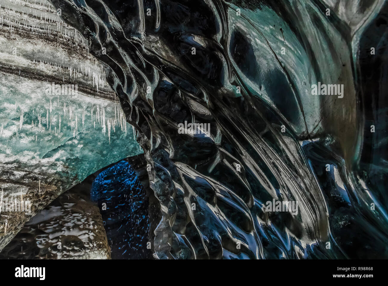 The melted sides of a vertical shaft of a moulin, aka glacier mill, the