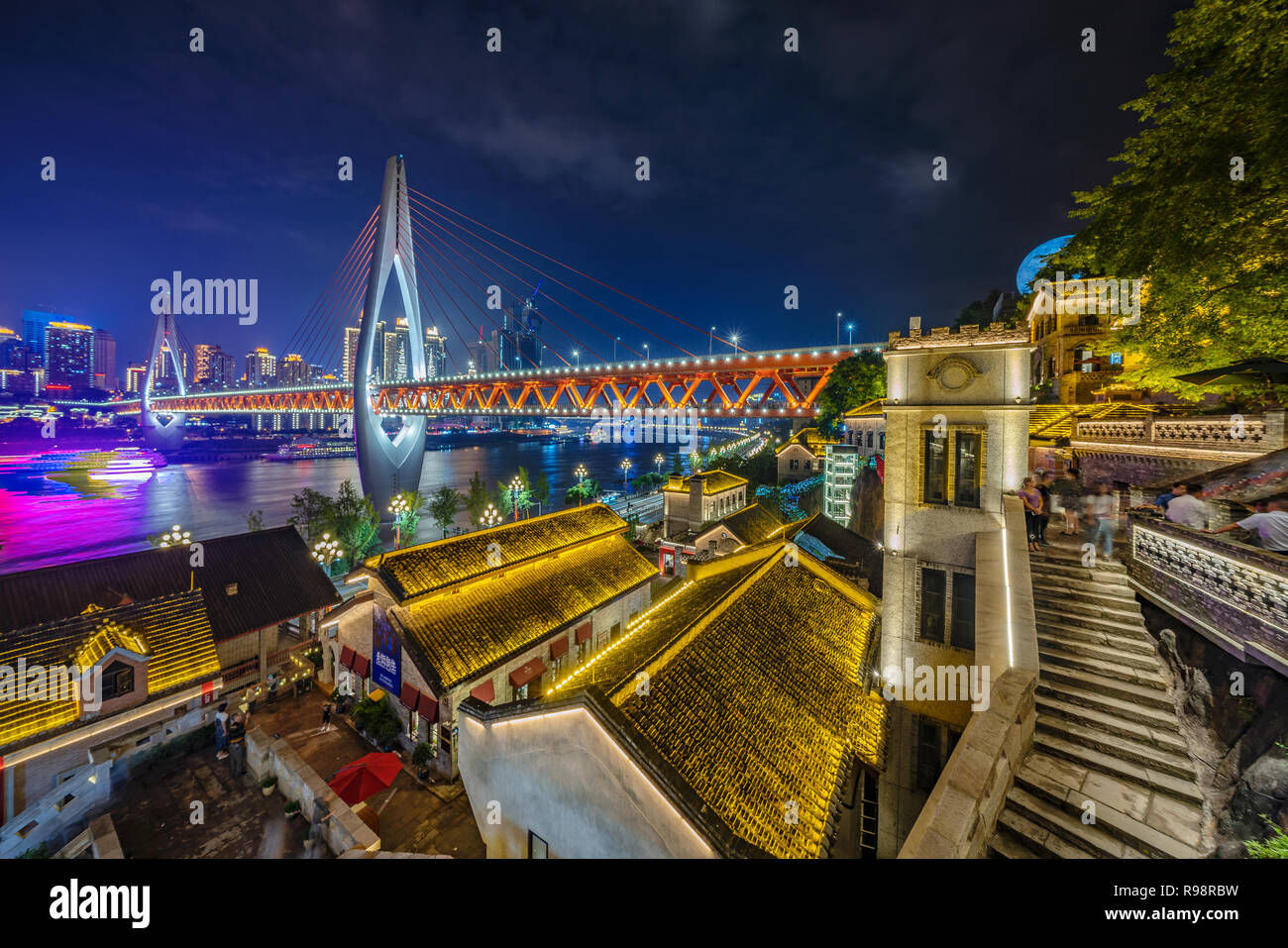CHONGQING, CHINA - SEPTEMBER 22: Night view of traditional Chinese architecture Longmenhao old street and Dongshuimen bridge on September 22, 2018 in  Stock Photo