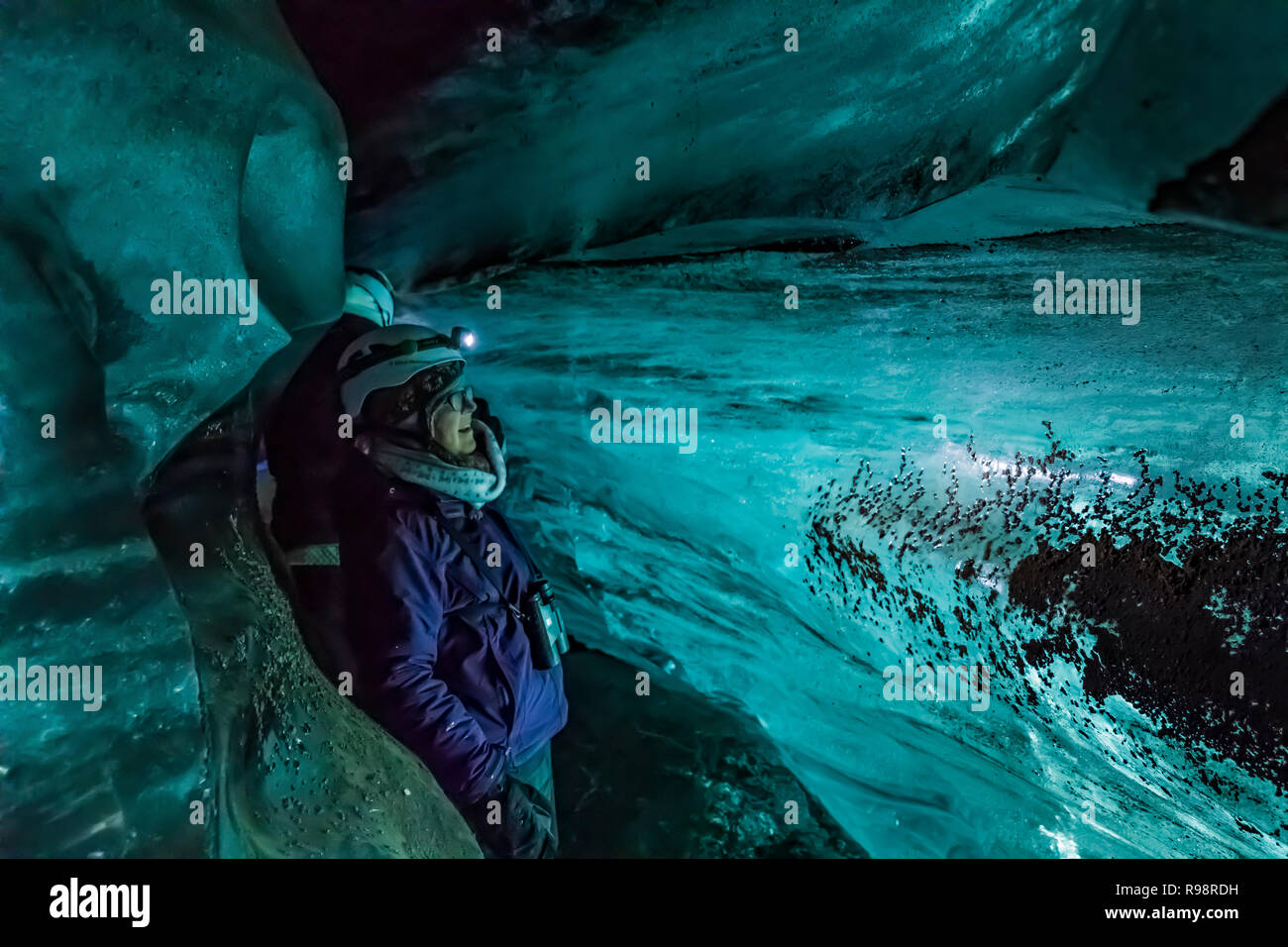 Karen Rentz on an ice cave tour to a lobe of Mýrdalsjökull Glacier, which sits atop Katla Volcano, in winter in Iceland Stock Photo