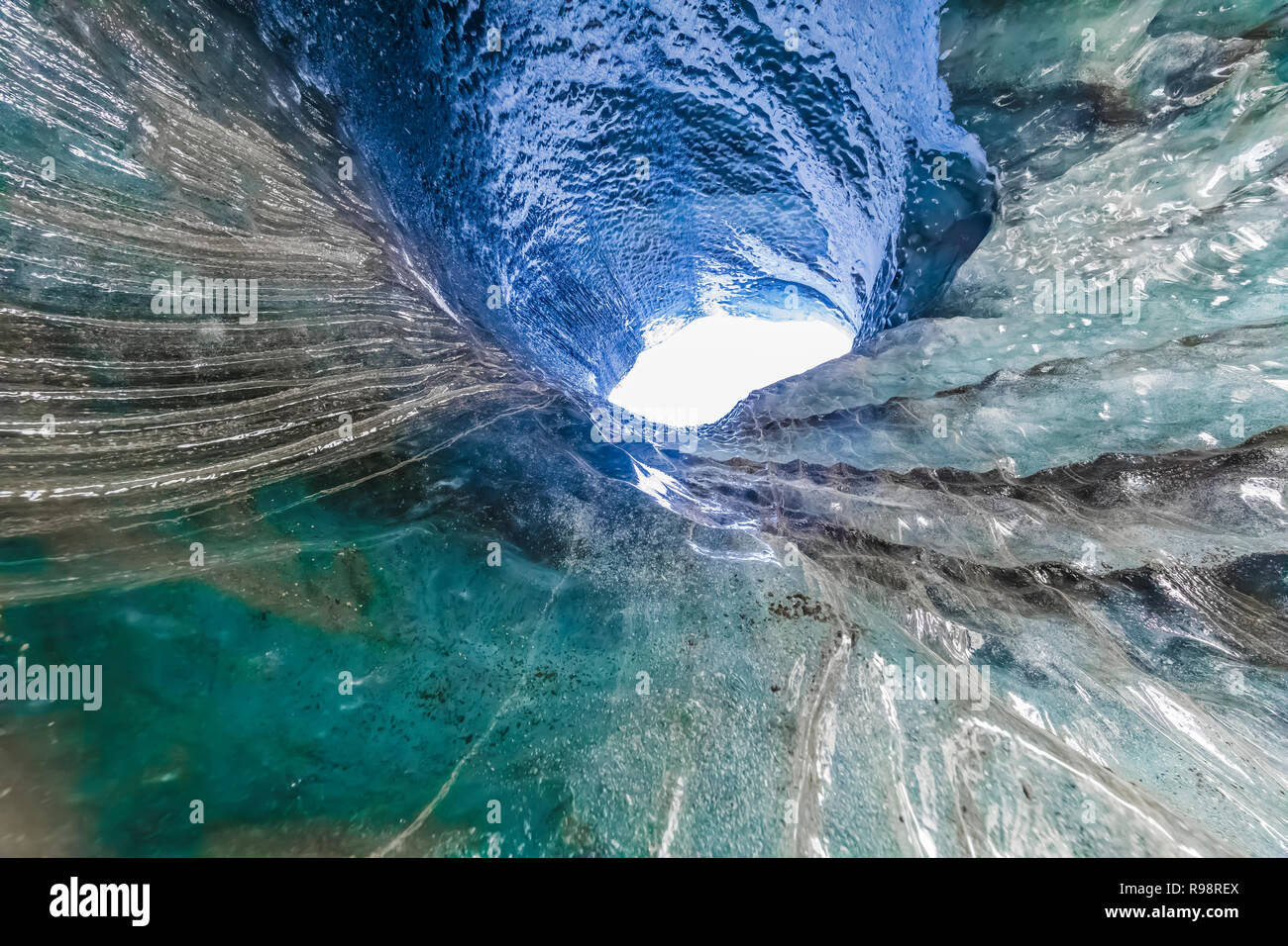 The melted vertical shaft of a moulin, aka glacier mill, the dramatic