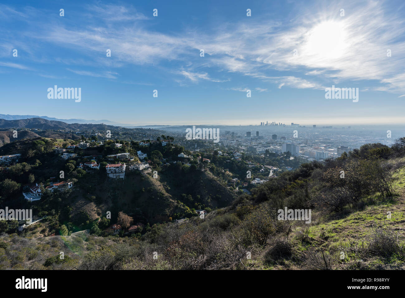 Clear morning view on canyon homes, Hollywood and downtown Los Angeles from hiking trail at Runyon Canyon Park. Stock Photo