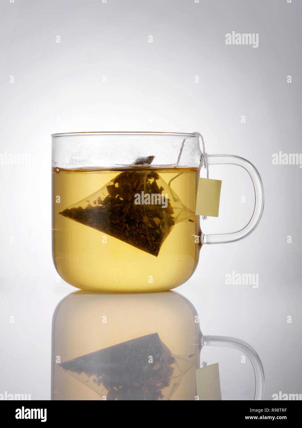 Glass teacup with teabag Stock Photo Alamy
