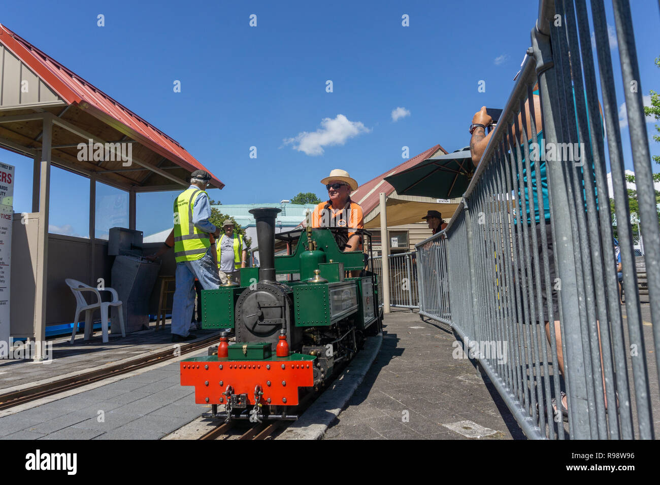 TAURANGA NEW ZEALAND - DECEMBER 16,2018; Model railway enthusiast engineers prepare vintage miniature train to offer rides. Stock Photo