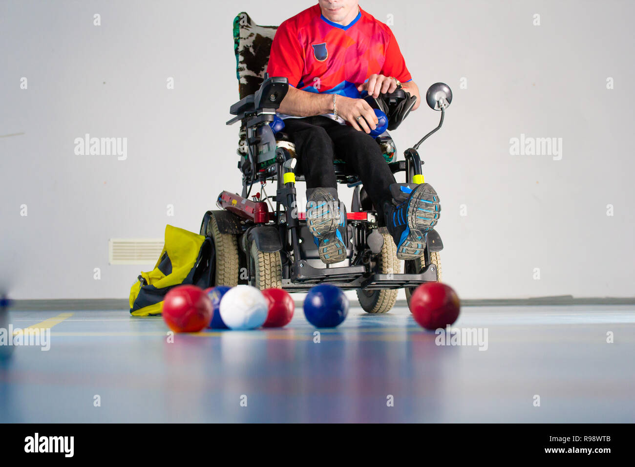 Boccia A Disabled Sportsman Sitting In A Wheelchair In Front Of Balls boccia-a-disabled-sportsman-sitting-in-a-wheelchair-in-front-of-balls