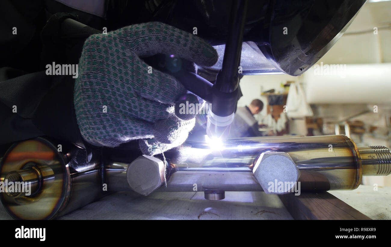 Industrial manufacturing. An iron pipe detail. Welding process Stock